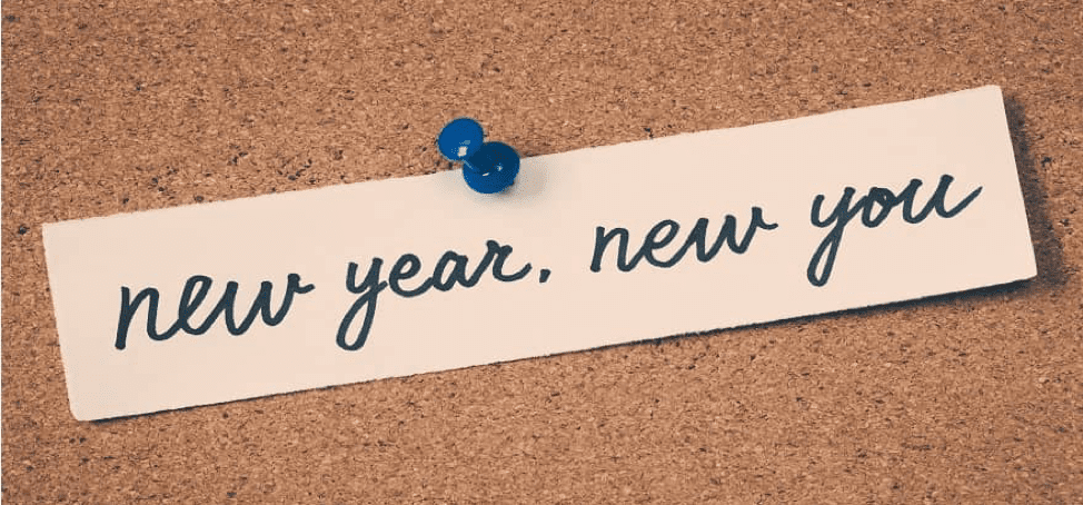 new year, new you written on a paper pinned on a board